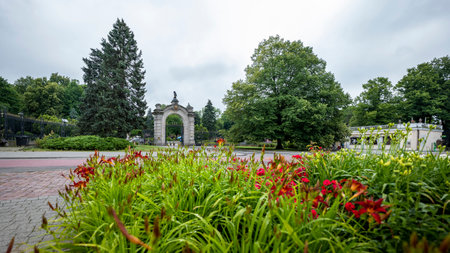 Chorzow, Poland - June 29, 2023: The monumental main gate to the zoo. Plants out of focus in the foreground.のeditorial素材