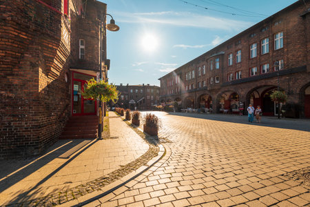 Katowice, Poland - August 05, 2023: Traditional, Silesian district Nikiszowiec. Renovated, old, brick block houses, build for coal miners in 1908-1919.Beautiful, afternoon light.のeditorial素材