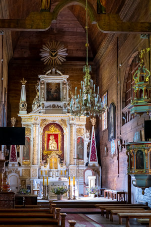 Tomaszow Lubelski, Poland - August 11, 2023: Church of the Annunciation of the Blessed Virgin Mary in TomaszÃ³w Lubelski. The interior of the lair church. View of the altarのeditorial素材