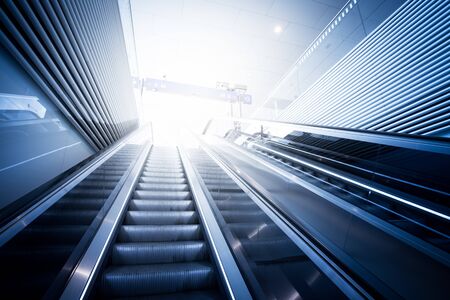 Travelling scene on train station, moving stairway for public transportの写真素材