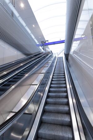 Travelling scene on train station, moving stairway for public transportの写真素材