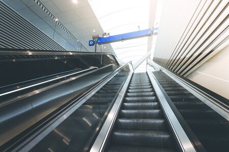 Travelling scene on train station, moving stairway for public transportの写真素材