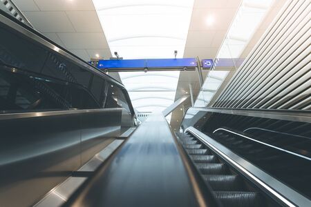 Travelling scene on train station, moving stairway for public transportの写真素材