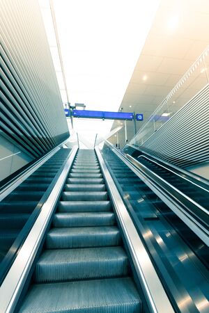 Travelling scene on train station, moving stairway for public transportの写真素材