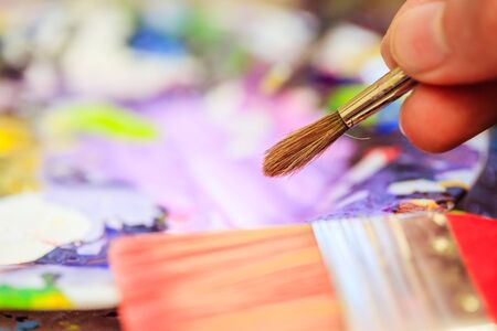 Artist paint brush on painting background. Painting therapy.の写真素材