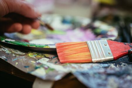 Artist paint brush on painting background. Painting therapy.の写真素材