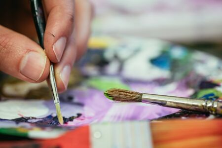 Artist paint brush on painting background. Painting therapy.の写真素材