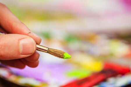 Artist paint brush on painting background. Painting therapy.の写真素材