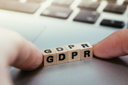 GDPR: Wooden cubes with letters âGDPRâ lying on a laptop. General Data Protection Regulationの写真素材