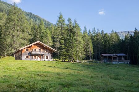Mountain chalet in Austria: Idyllic landscape in the Alpsの写真素材