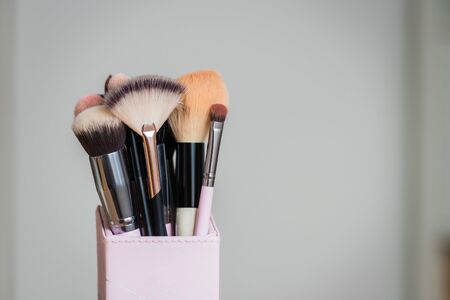 Set of makeup brushes and other accessories. Products for makeup on white background