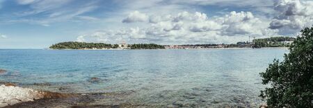 Beautiful bay near Rovinj, clear water and stony beach, Croatiaの写真素材