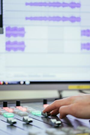 Moderator and soundboard in radio broadcasting studioの写真素材