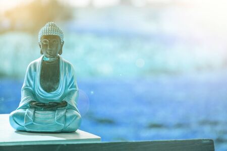 Buddha statue at an Indian temple, summer time. Text space.の写真素材
