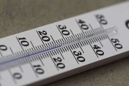 Thermometer close up picture in summer time, blurry background