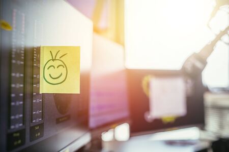 Feedback and motivation concept: Smiley Illustration at the working placeの写真素材