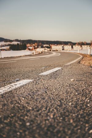 Black rough asphalt road in Austria, closeup