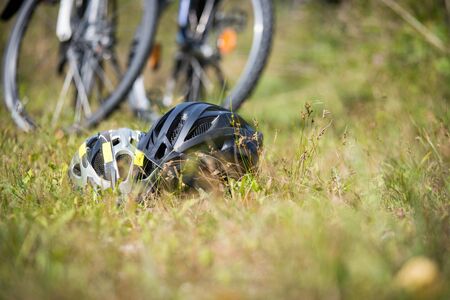 Bike helmets in the grass, bike tourの写真素材