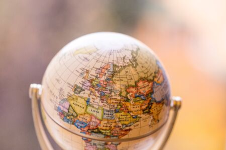 Close up of an old vintage globe, blurry backgroundの写真素材