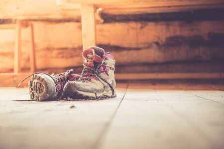 Alpine boots inside of a rustic mountain chalet, Austria