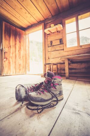 Alpine boots inside of a rustic mountain chalet, Austriaの写真素材