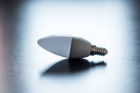 White light bulb lying on a desk, concept for ideas