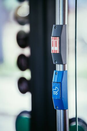 Red stop button in a bus, commuting, public transport