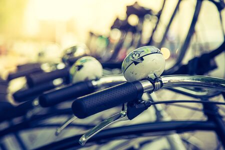 Colorful bike bells on parked bikes, urban city lifeの写真素材