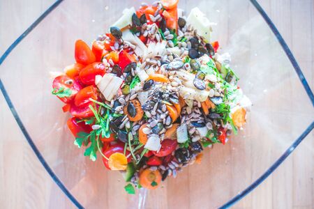 Close up of a mixed, healthy salad in a glass bowl, summer timeの写真素材