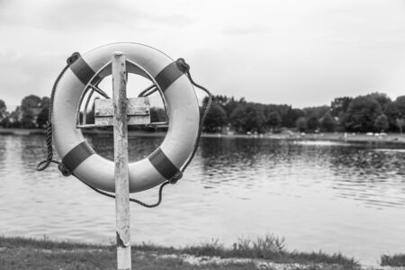 Close up picture of a safety buoy at a swimming lake, summer timeの写真素材