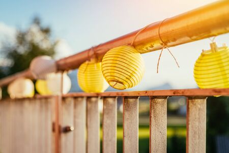 Close up of summer lampions on a balcony, leisure time in the summer holidaysの写真素材