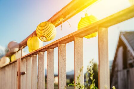 Close up of summer lampions on a balcony, leisure time in the summer holidaysの写真素材