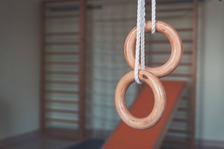 Close up of gym rings in the gym hall of a preschoolの写真素材