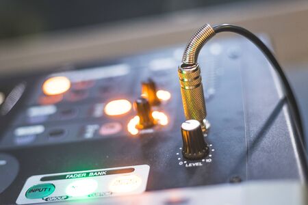 Professional music production in a sound recording studio, mixer desk