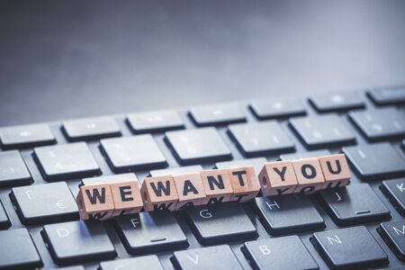 âWe want youâ letters on black keyboard, close up. Human resources.の写真素材