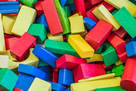 Colorful wooden toy blocks in a box