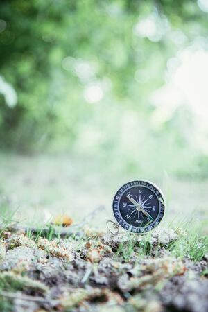 Vintage compass lying on the floor. Adventure and discovery concept.の写真素材
