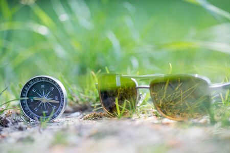 Vintage compass lying on the floor. Adventure and discovery concept. の写真素材