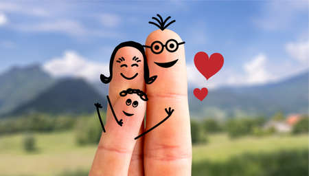 Painted fingers happy family concept making holidays in natureの写真素材