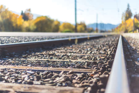 Landscape of an old abandoned railway in fall. Warm light, sustainable travelingの写真素材