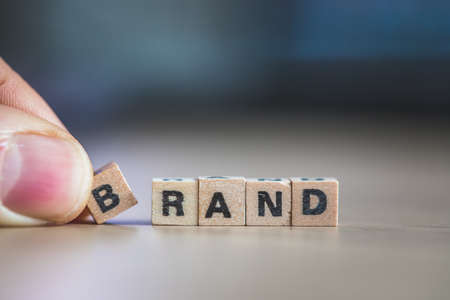 Wood cubes with the word âBrandâ, close up picture with copy space. Identity, marketing, businessの写真素材