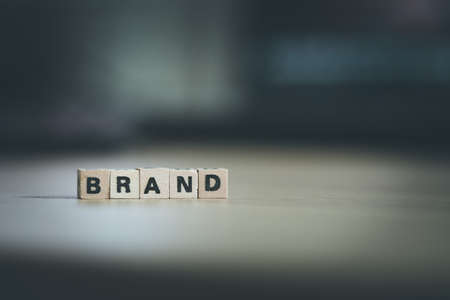 Wood cubes with the word âBrandâ, close up picture with copy space. Identity, marketing, business. Text space.の写真素材