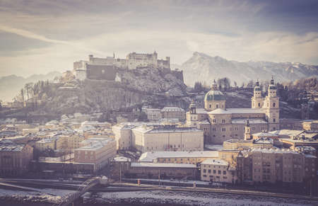 Salzburg historic district at Christmas time, snowy rooftops with sunshine, Austriaのeditorial素材