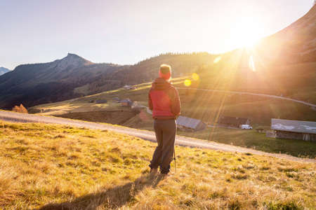 Woman in sportswear is enjoying the sunset in the mountains. Alpes, Austriaの写真素材