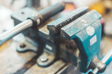 Close up of a metal vice in a garage workshop