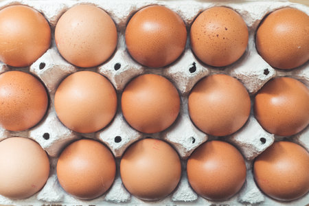 Top view of chicken eggs in a basket.の写真素材