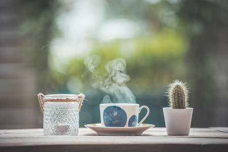 Enjoying a cup of tea in the own garden, copy space