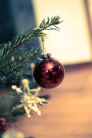 Cut-out of a traditionally decorated Christmas tree with Christmas baubles.の写真素材