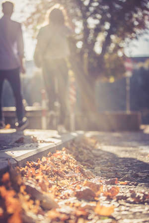 Young couple in autumn: Going for a walk, sunbeamの写真素材