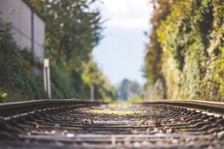 Landscape of an old abandoned railway in fall. Warm light, sustainable travelingの写真素材